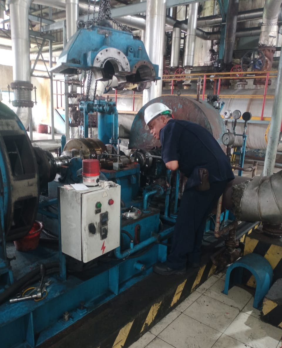 SGE technician inspecting turbine equipment on site